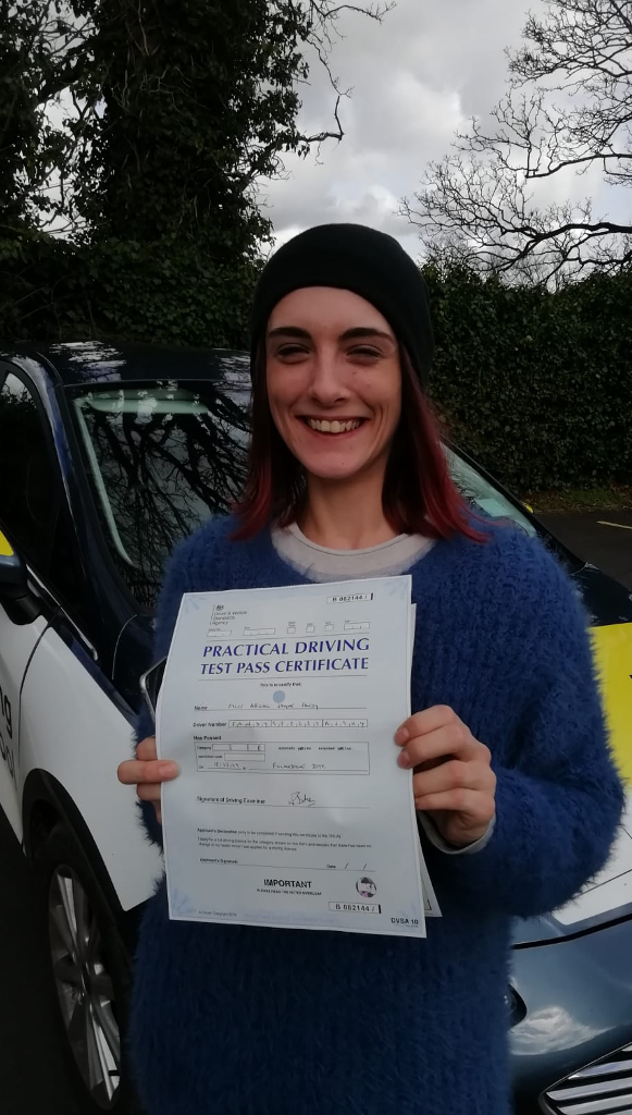 A student passes her driving exam